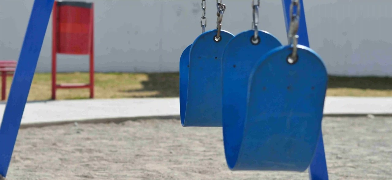 Blue swings in kids playground