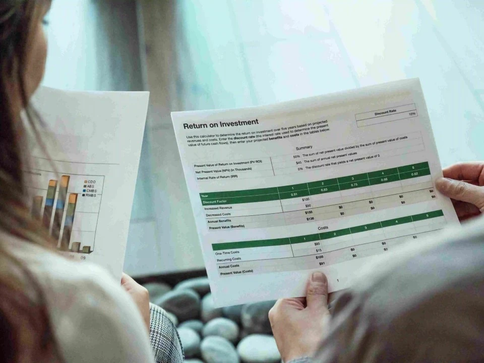 person viewing financial document in an office background 
