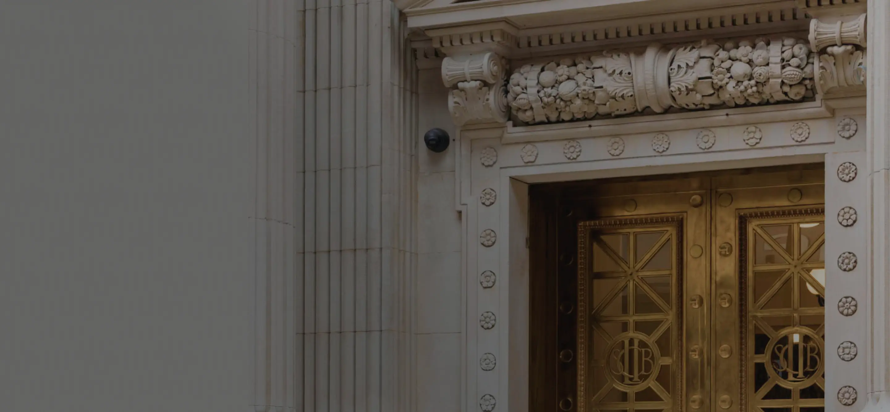 Close up of Optimize Wealth Management Building's historic façade.