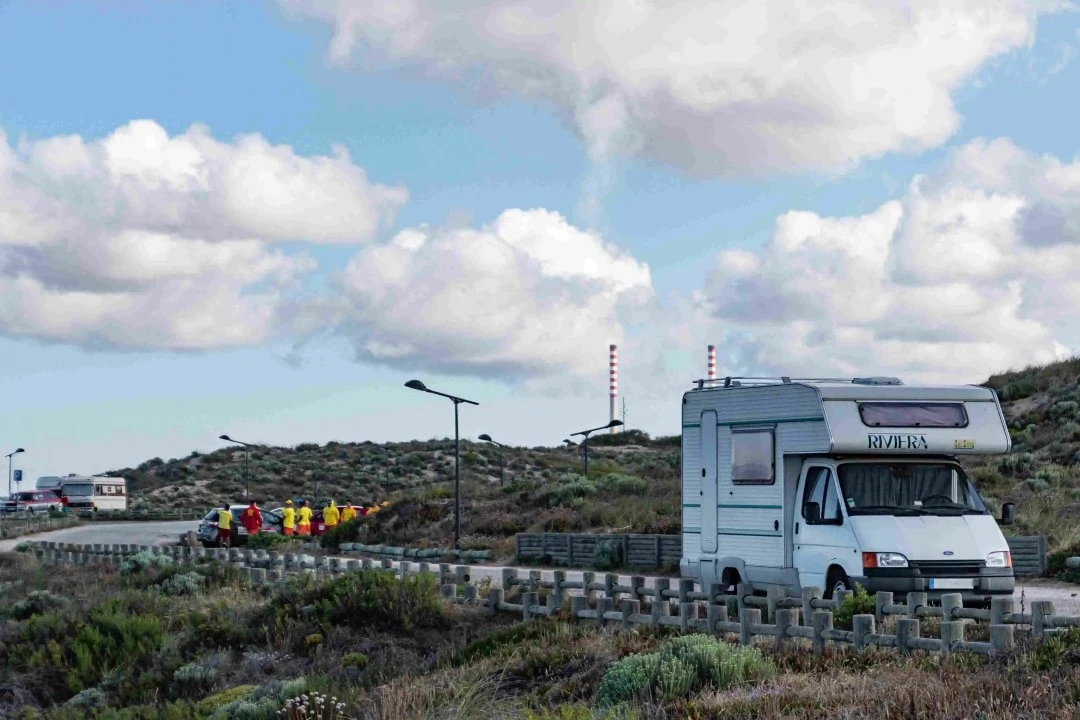 A White RV (Recreational Vehicle) on a road