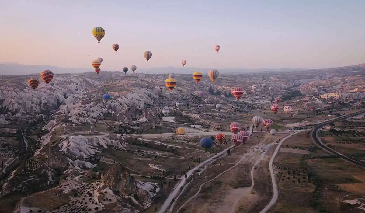 Hot Air balloons with hills in the background